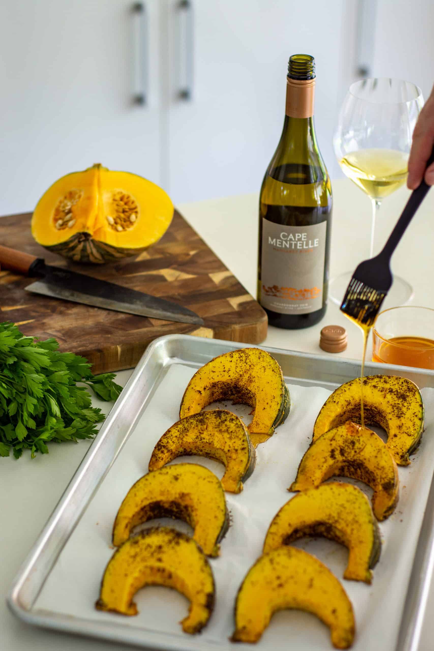 honey being drizzled over roasted pumpkin