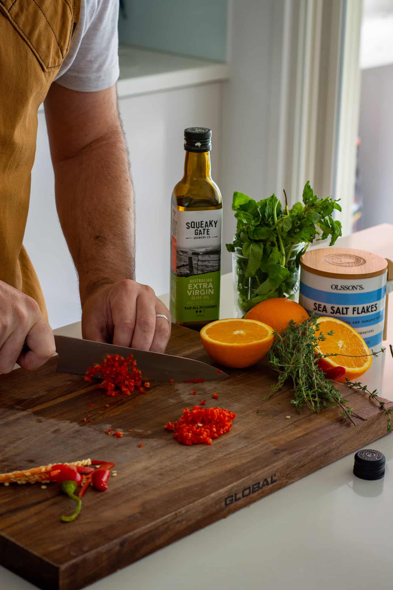 Someone chopping chilli in the kitchen