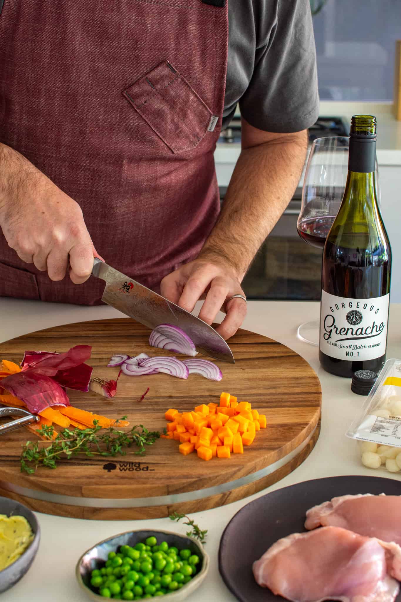 Someone slicing vegetables in the kitchen