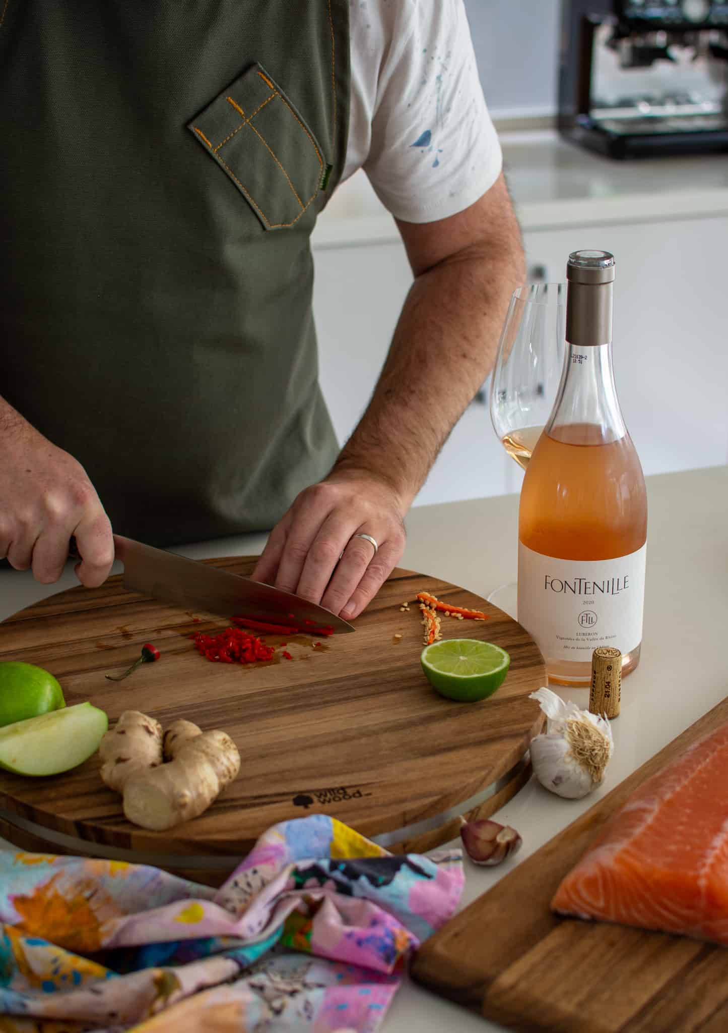 someone chopping chilli in the kitchen