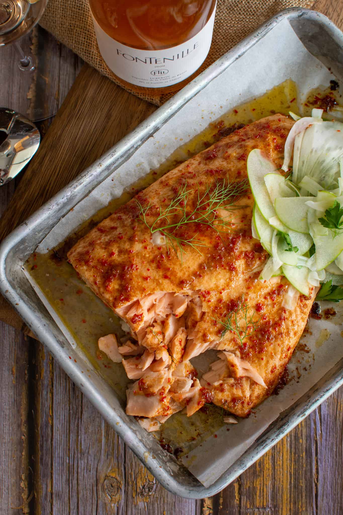 Birdseye view of maple glazed salmon, fennel salad and fontenille rose wine