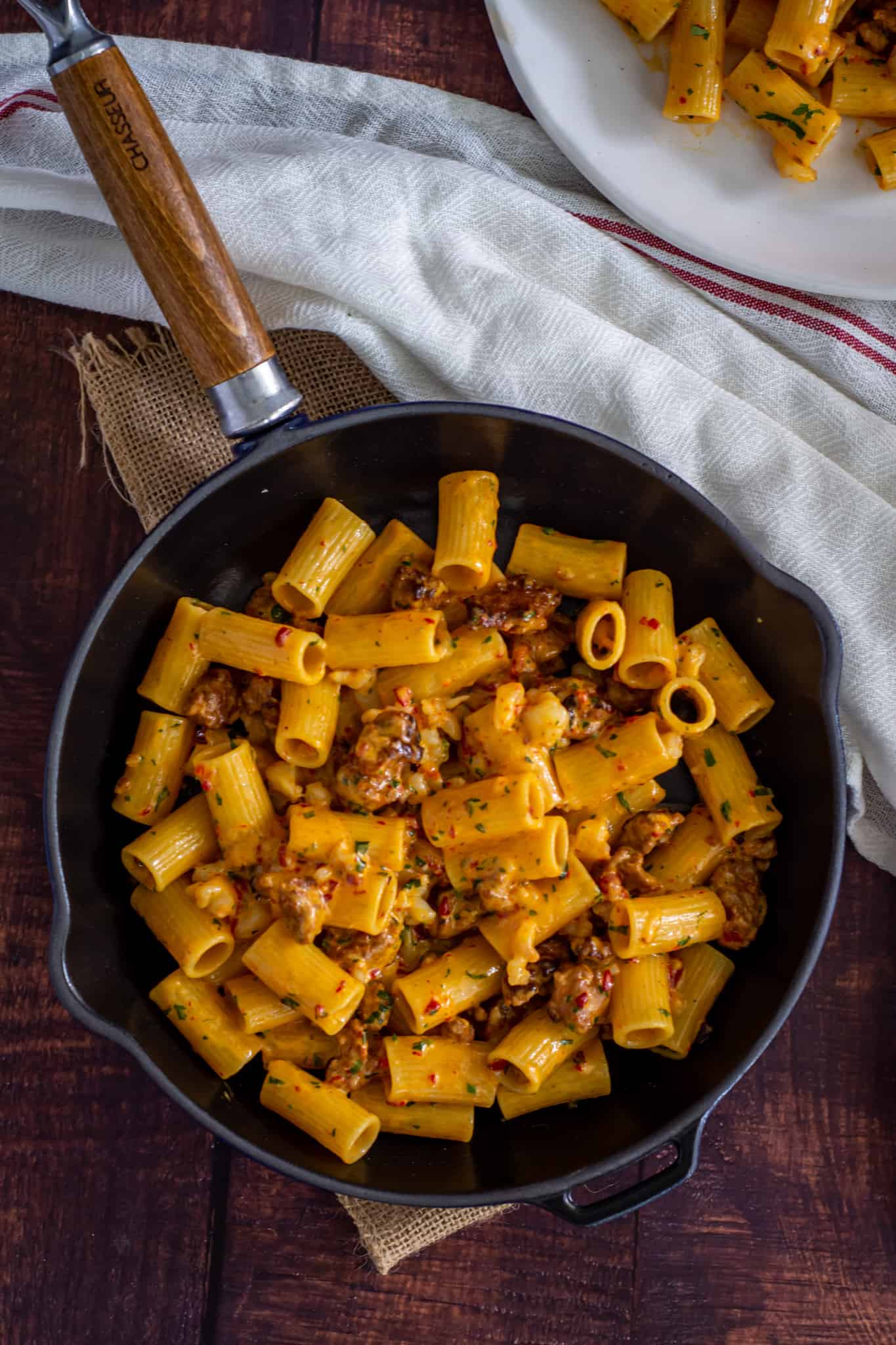 Birdseye view of prawn and chorizo pasta in a skillet