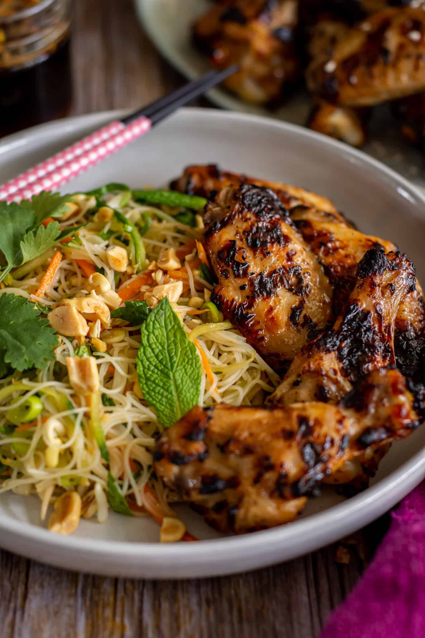 close up of chicken vermicelli noodles on a plate