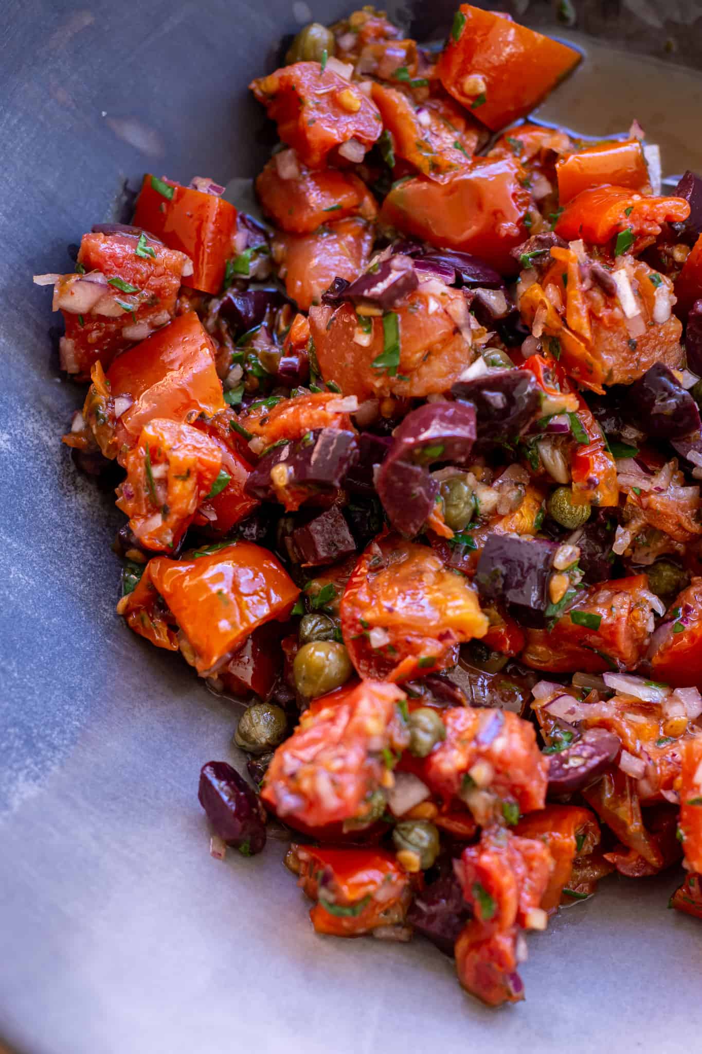 close up of sundried tomato and olive salsa in a bowl