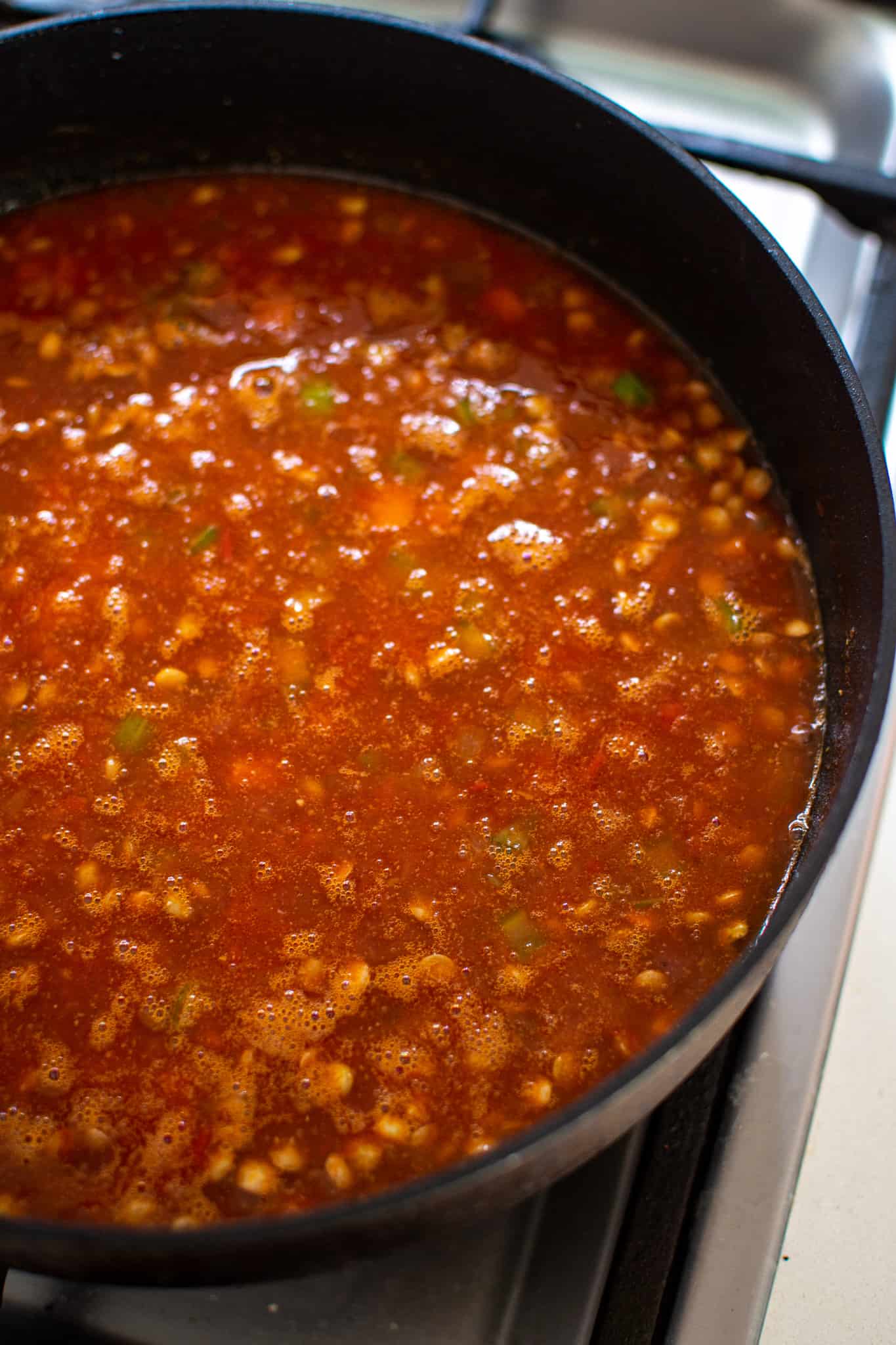 lentil stew cooking in a pan