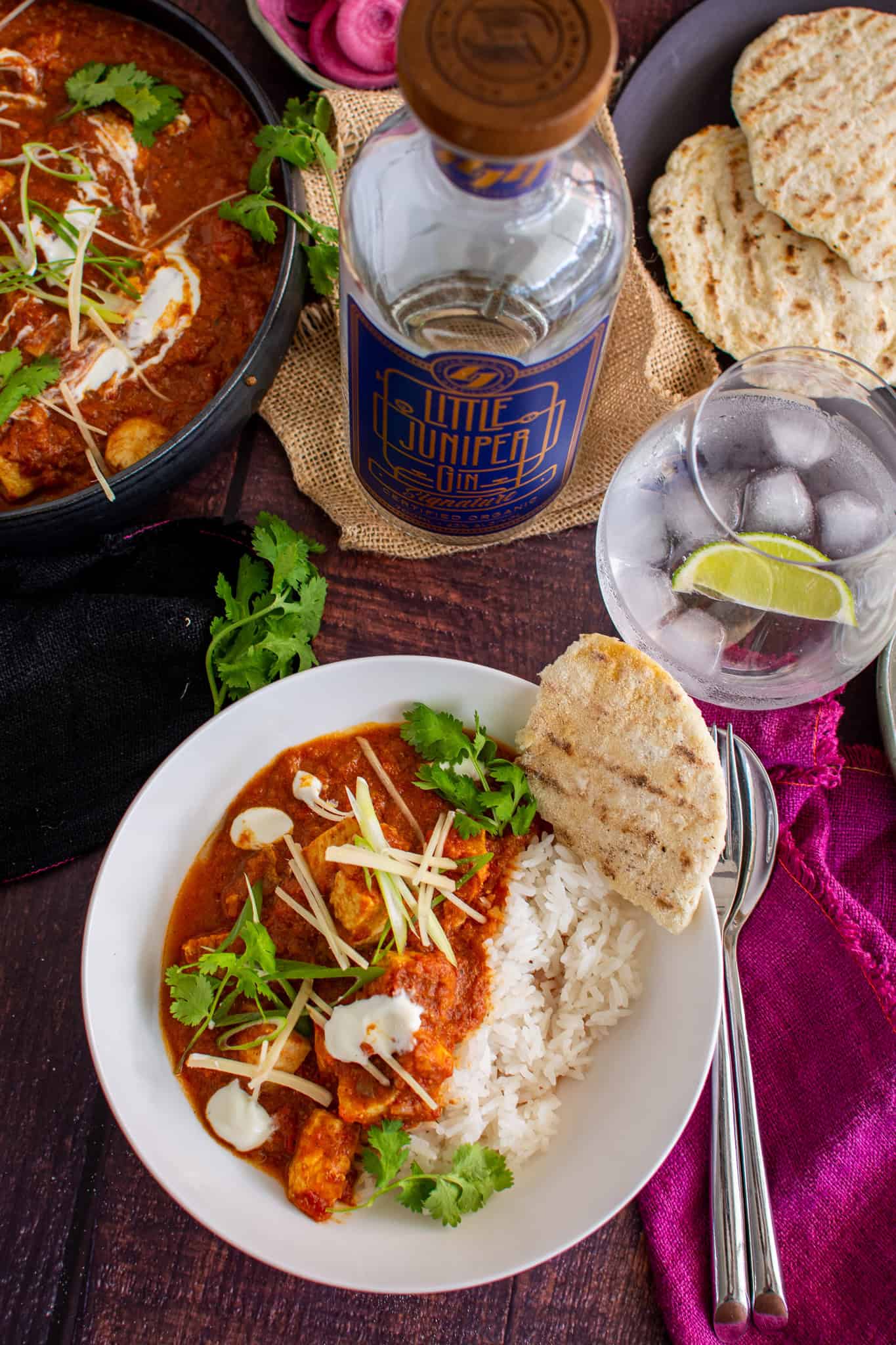 Delicious bowl of swordfish curry with a gin and tonic next to it!